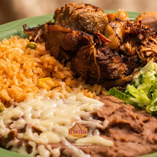 A green plate with Mexican rice, refried beans with melted cheese, shredded pork, and lettuce.